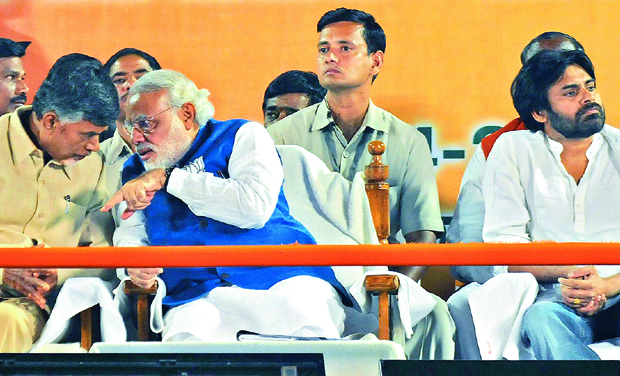 Narendra Modi talks to Telugu Desam chief N. Chandrababu Naidu during his meet . Actor Pawan Kalyan is also seen. Photo: DC Narendra Modi talks to Telugu Desam chief N. Chandrababu Naidu during his meet . Actor Pawan Kalyan is also seen. Photo: DC